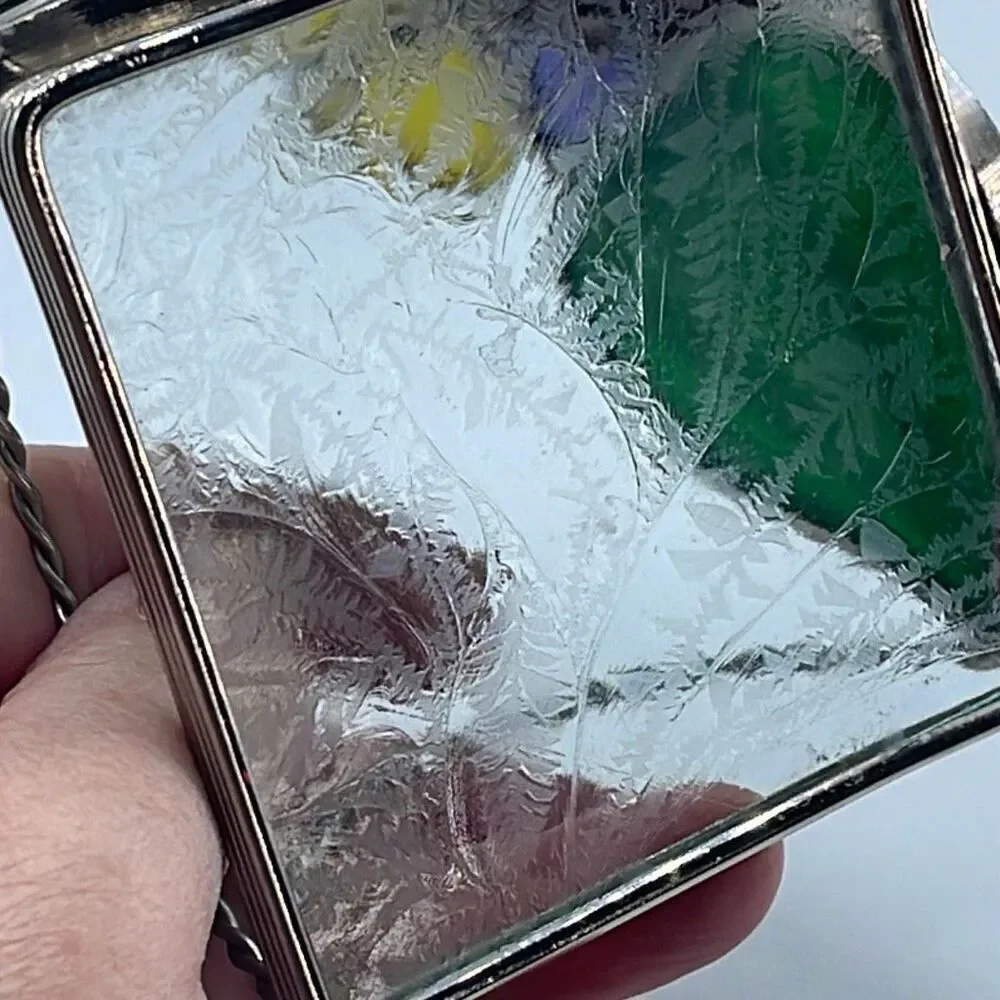 Stained glass leaded framed tea light holder.